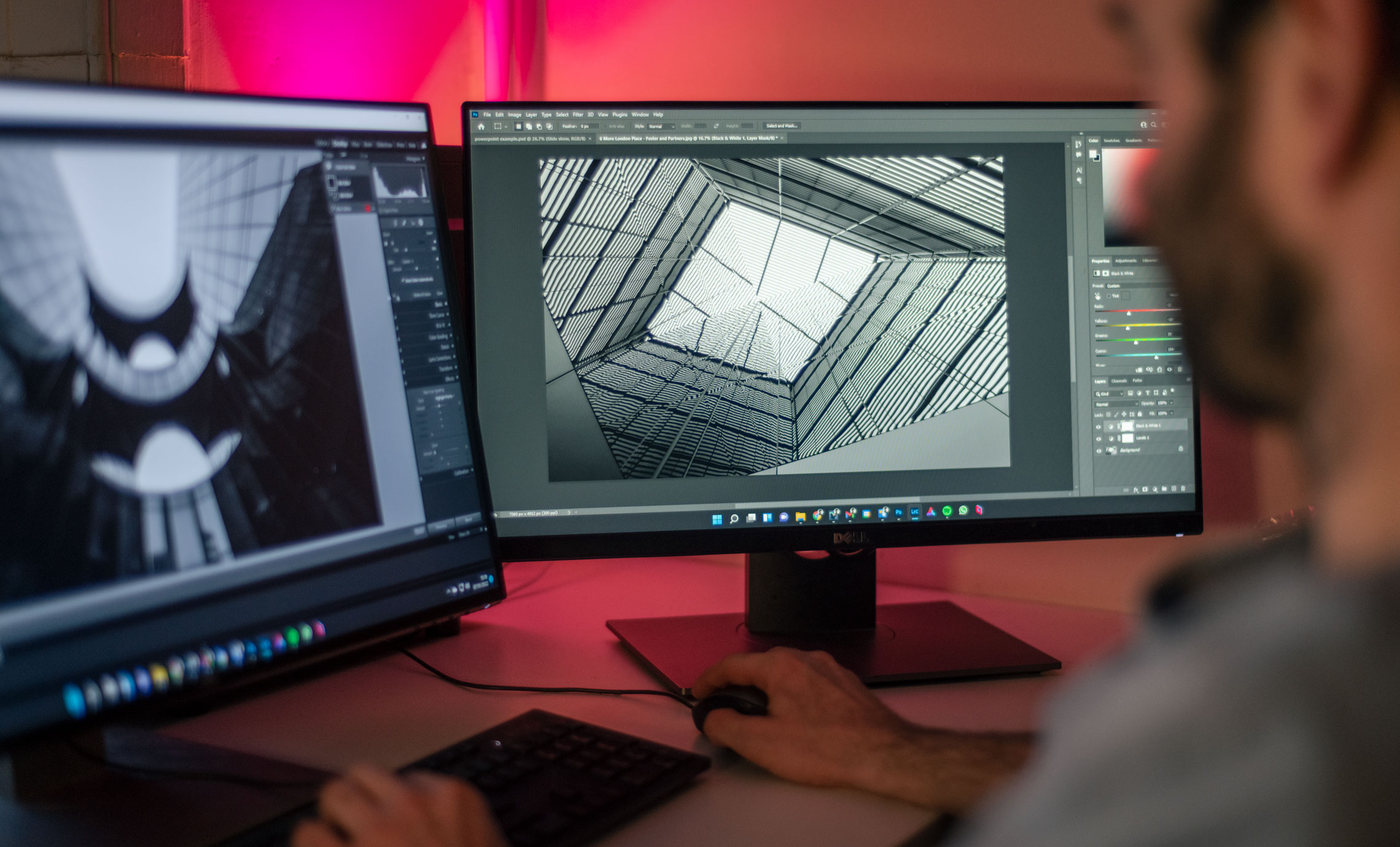 Editor on dual screens editing architectural abstrac photographs
